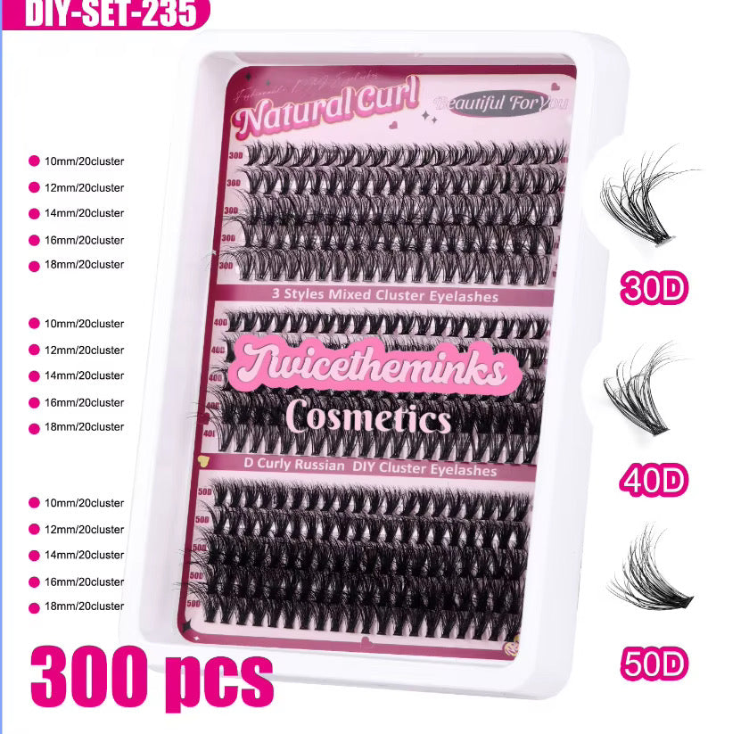 A tray of 300 Pink Dream Clusters by Juicetheminks Cosmetics in Natural Curl, featuring a selection of lash clusters in various lengths and curls. Illustrations on the right display natural wispy styles in 30D, 40D, and 50D, while detailed information about the clusters is listed on the left.